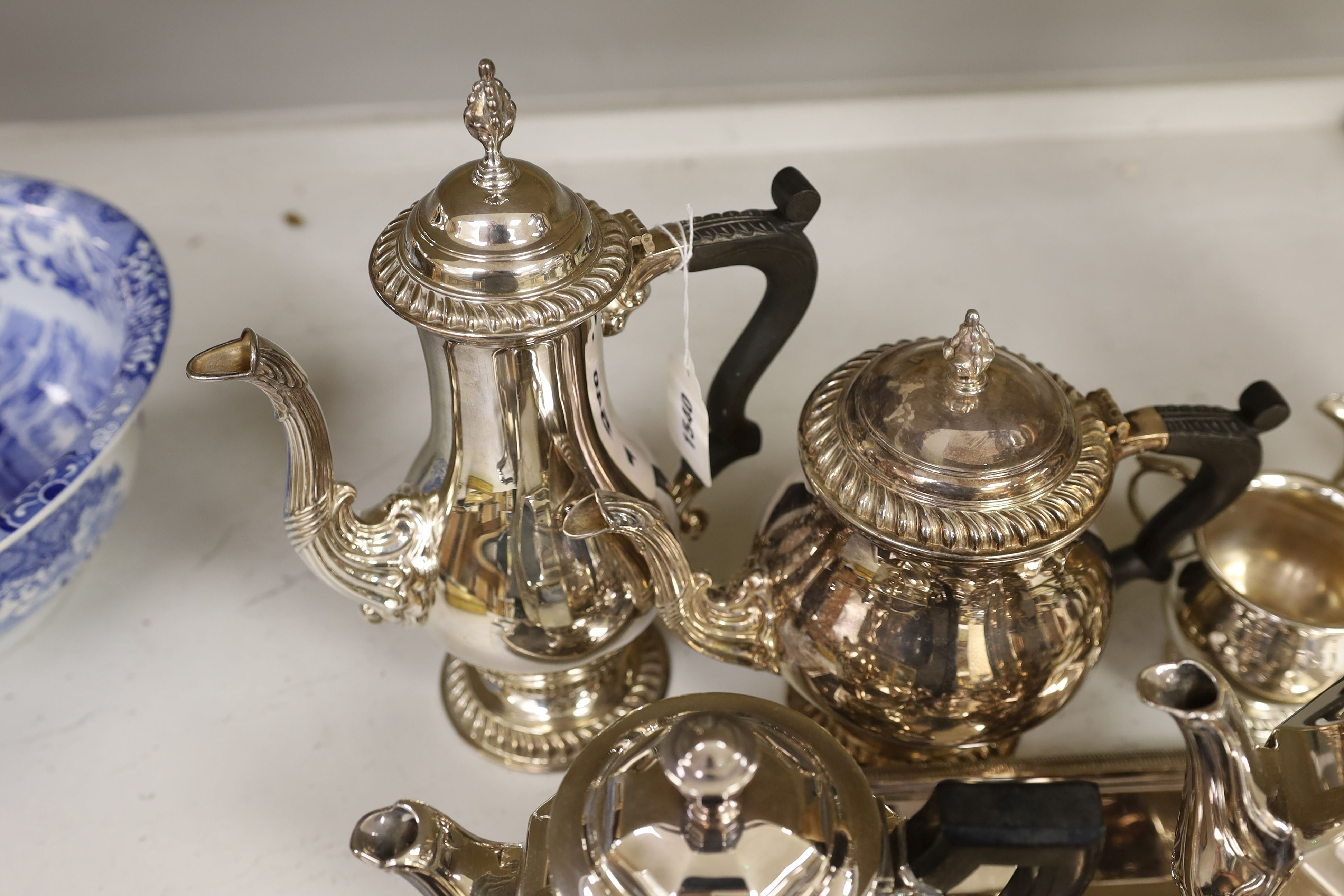 A French plated Cristofle tea set, together with other plated tea wares and a candelabrum